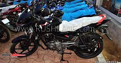 New Bajaj Pulsar 150 with Bright Red Logo, Grab Rail Etc Spotted at Dealer Warehouse