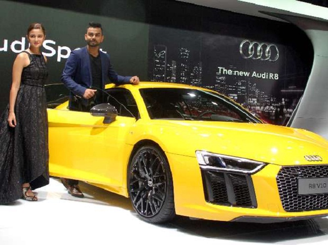 Alia Bhatt and Virat Kohli posing with newly launched Audi R8 V10 Plus