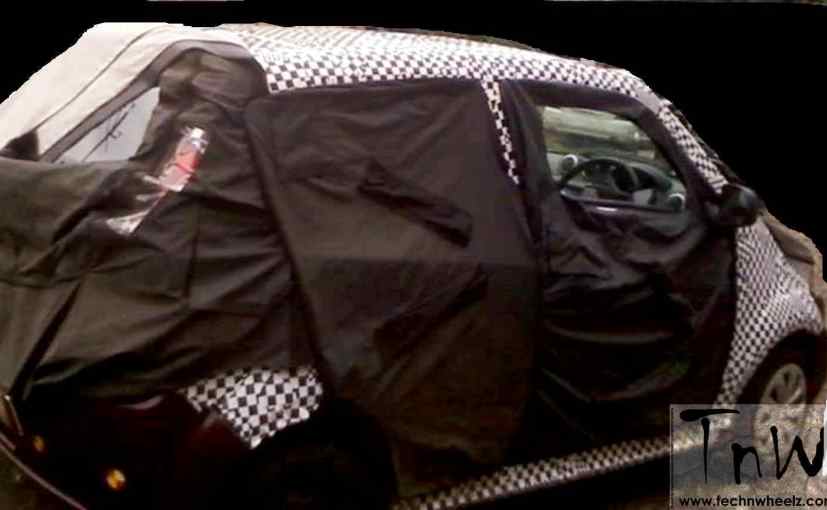  Mahindra e2o four-door spy shot Side rear Profile