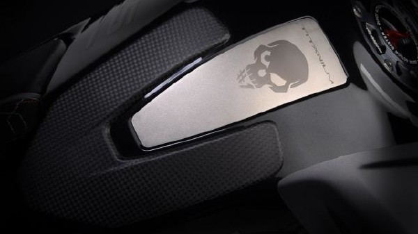 Titanium plate with engraved skull on the fuel tank